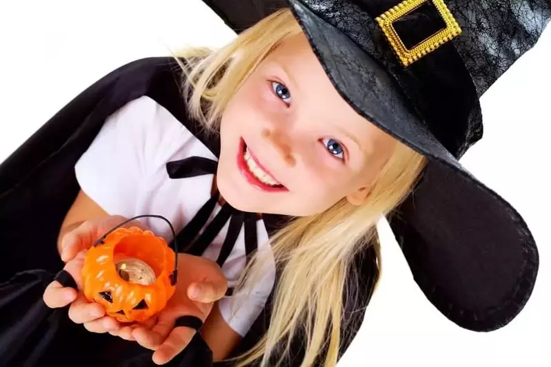 Little girl dressed as a witch for Halloween