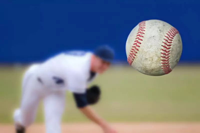 Pitcher throwing baseball