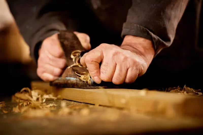 Craftsman demonstrating carpentry