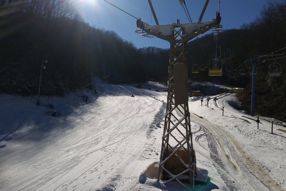 ski lift over snowy slope at Ober Mountain