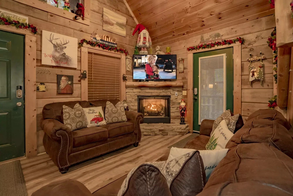 A Mountain Heart Song living room with Christmas decorations