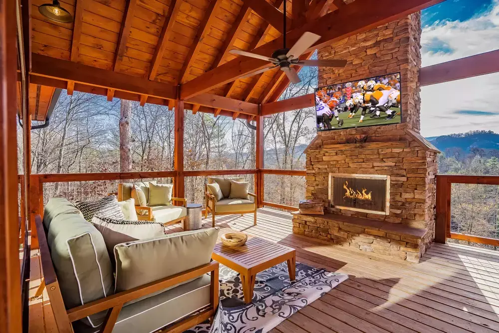 Serenity Splash Lodge deck with fireplace and mountain view