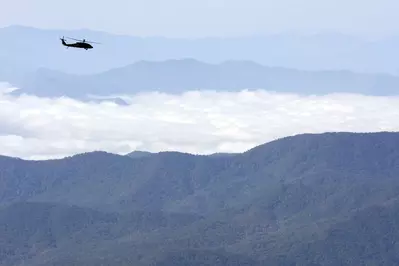 helicopter flying over Smoky Mountains
