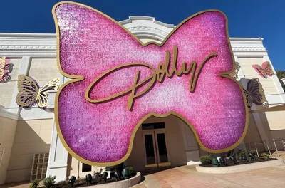 pink butterfly-shaped Dolly sign at the Dolly Parton Experience in Dollywood
